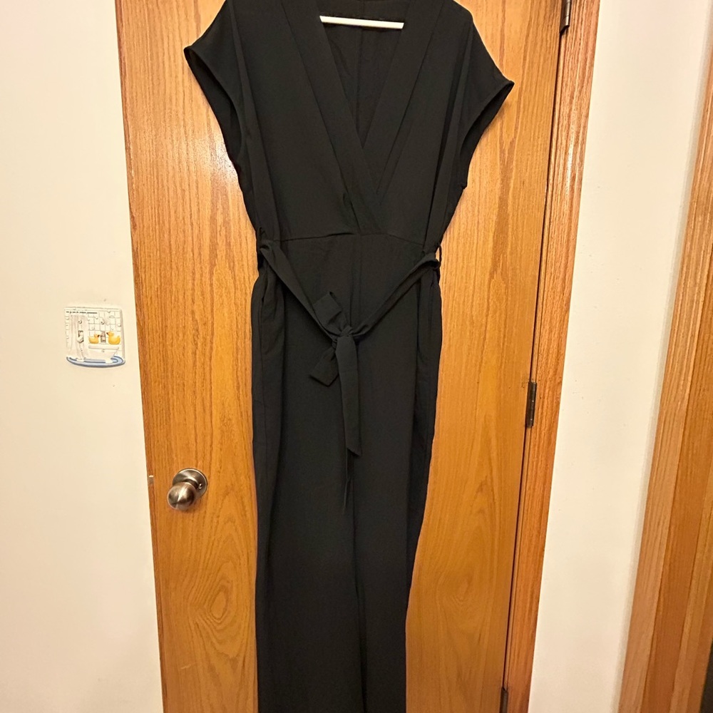 Jumpsuit, with pockets! Size 1X, black with elastic waist,  and belt. NWOT